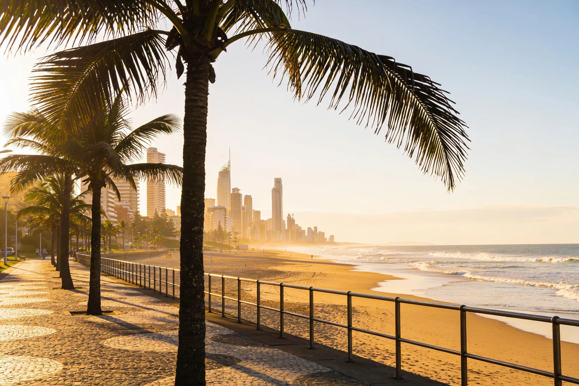 The Golden Mile beachfront promenade and Durban skyline at sunrise