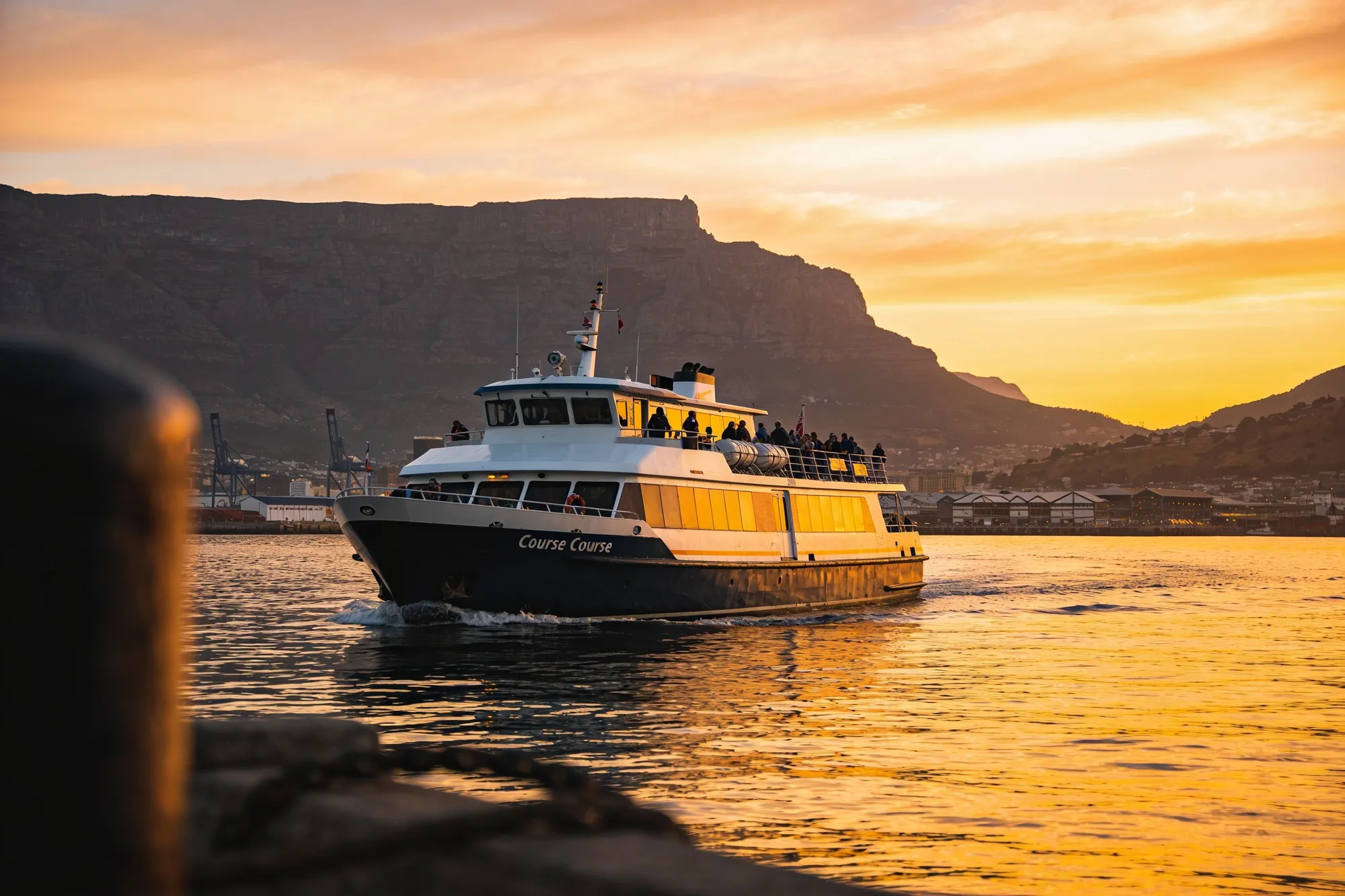 Photo — A sunset cruise leaving Table Bay
